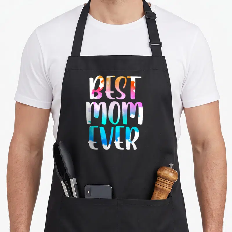 Vintage mother's day aprons - Stacked BEST MOM EVER text in watercolor orange pink blue and white — shown on a black cotton canvas apron against a white background