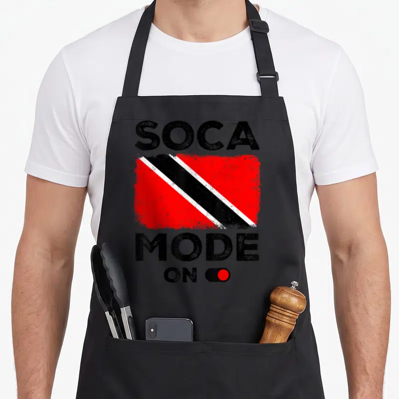 Soca trinidad and tobago apron - Distressed SOCA MODE ON text with Trinidad and Tobago flag and red toggle switch — shown on a black cotton canvas apron against a white background