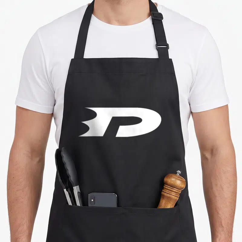 Danny little miss apron - White stylized letter P logo printed on black apron fabric — shown on a black cotton canvas apron against a white background