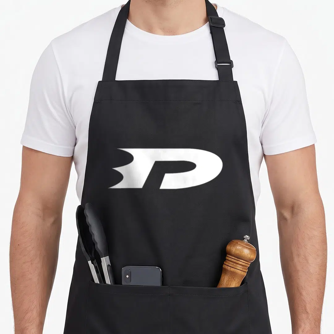 Danny little miss apron - White stylized letter P logo printed on black apron fabric — shown on a black cotton canvas apron against a white background