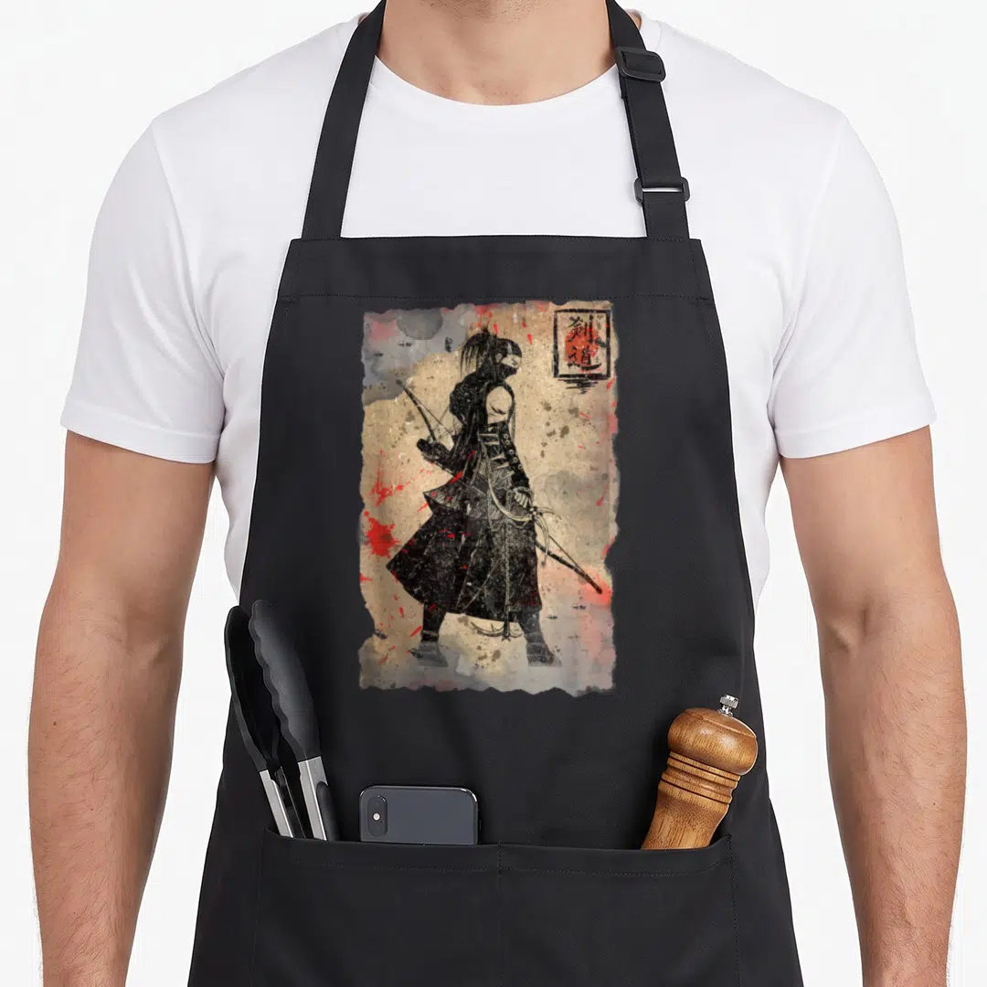 Japanesse japan apron - Black samurai silhouette on beige background with red splatters and kanji seal in top right — shown on a black cotton canvas apron against a white background