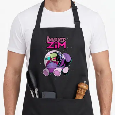 Invader rocket apron - Green alien in purple spaceship under pink INVADER ZIM text — shown on a black cotton canvas apron against a white background