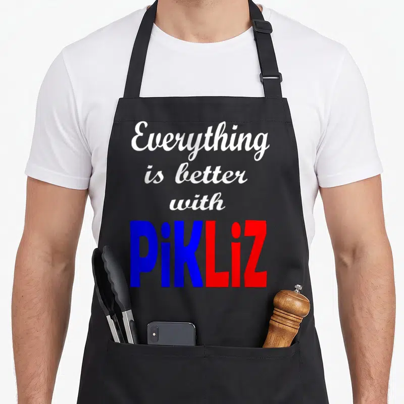 Pikliz pride apron - Everything is better with PiKLiz text in white script and blue red block letters — shown on a black cotton canvas apron against a white background