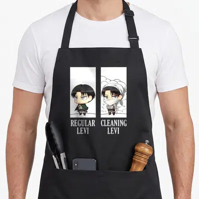 Cleaning anime apron - Chibi Levi regular and cleaning comparison with stacked white text below vertical panels — shown on a black cotton canvas apron against a white background
