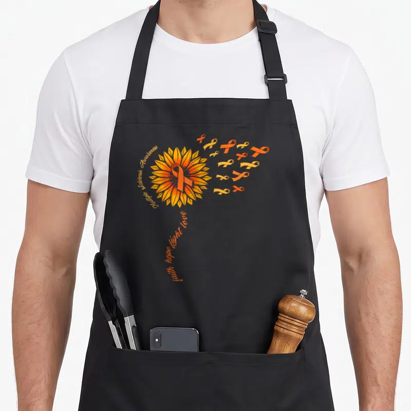 Warrior faith aprons - Sunflower with orange ribbon and text Multiple Sclerosis Awareness faith hope fight love — shown on a black cotton canvas apron against a white background