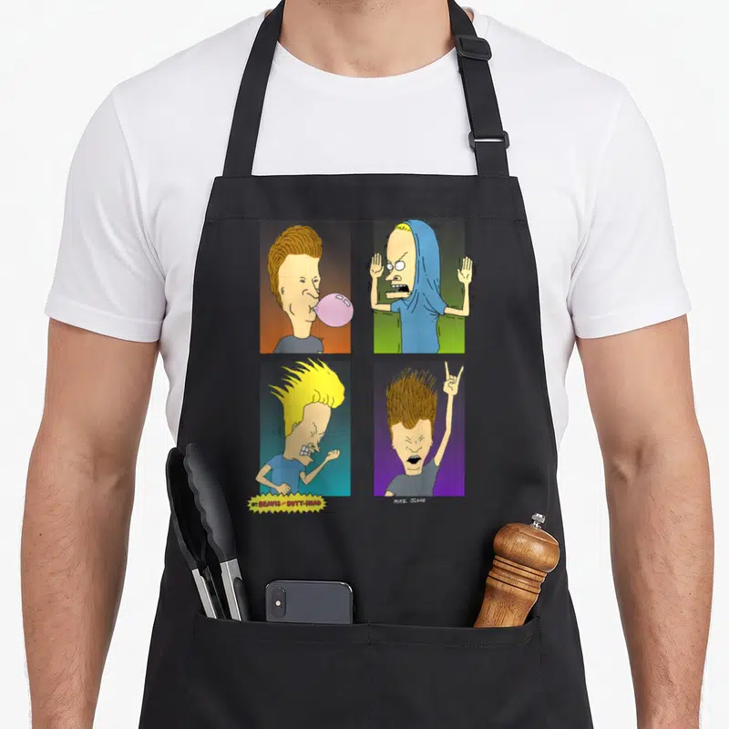 Beavis square apron - Four cartoon heads in grid with yellow pink blue green purple backgrounds and title text — shown on a black cotton canvas apron against a white background