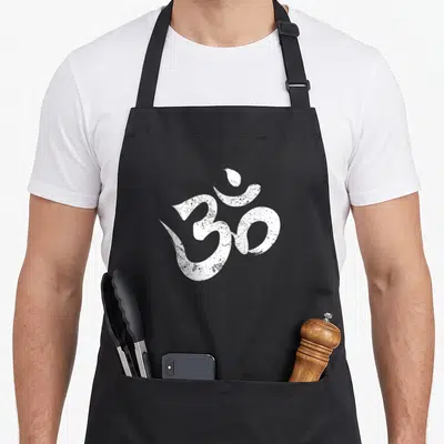 Outfit om symbol apron - Distressed white Om symbol centered on dark background with no text — shown on a black cotton canvas apron against a white background