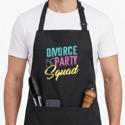 Divorce husband wife aprons - DIVORCE PARTY Squad text in blue, pink, yellow, and white with two white ring outlines — shown on a black cotton canvas apron against a white background