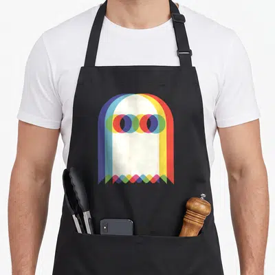 Threadrock halloween apron - Abstract geometric arch in blue yellow red green and cream with overlapping transparent — shown on a black cotton canvas apron against a white background