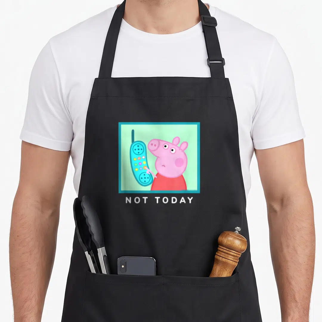 Today crazy pig man apron - Pink pig holding blue phone with NOT TODAY text in cartoon style — shown on a black cotton canvas apron against a white background