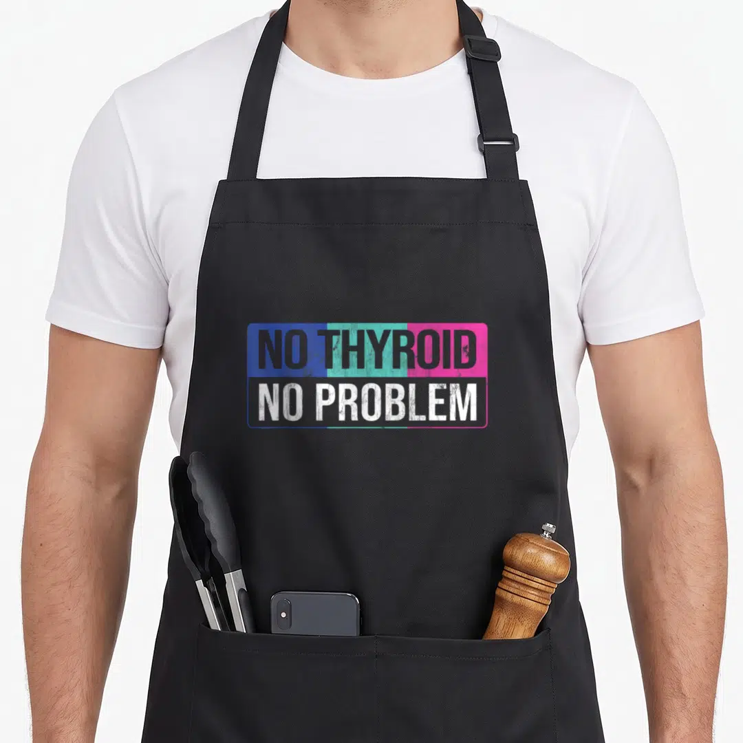 Problem thyroid apron - NO THYROID NO PROBLEM text in blue teal pink rectangular frame — shown on a black cotton canvas apron against a white background