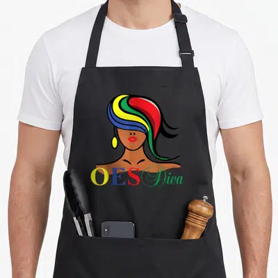 Diva christmas apron - Stylized woman with multi-colored hair and OES Diva text in cartoon art style — shown on a black cotton canvas apron against a white background
