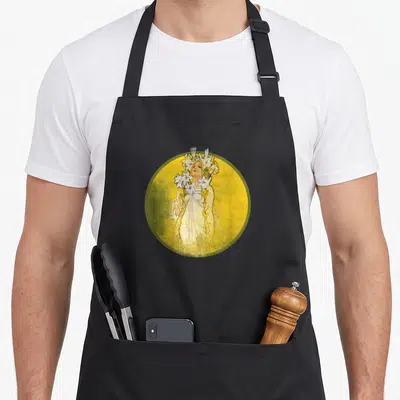 Nouveau white lily apron - Woman holding white lilies inside yellow circle with green border in art nouveau style — shown on a black cotton canvas apron against a white background