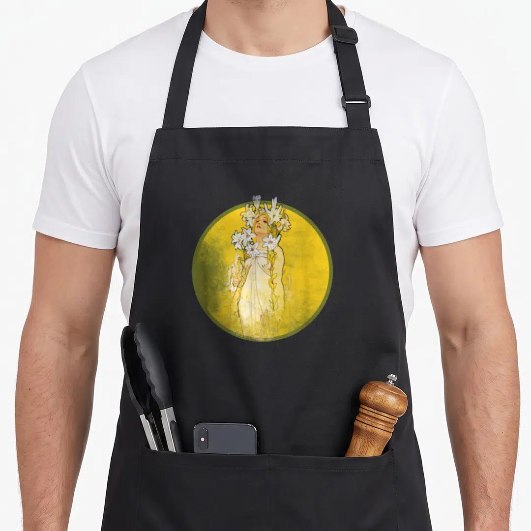 Nouveau white lily apron - Woman holding white lilies inside yellow circle with green border in art nouveau style — shown on a black cotton canvas apron against a white background