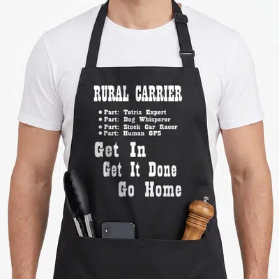 Rural parts of an apron - White stacked text reading Rural Carrier Parts Get In Get It Done Go Home — shown on a black cotton canvas apron against a white background