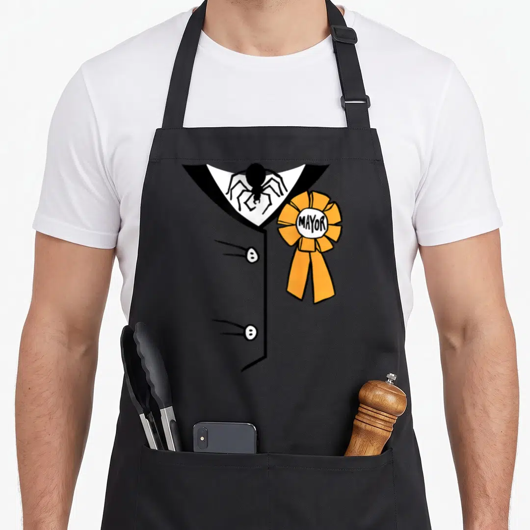 Costume mayor apron - Black spider on white suit collar beside orange ribbon with MAYOR text — shown on a black cotton canvas apron against a white background