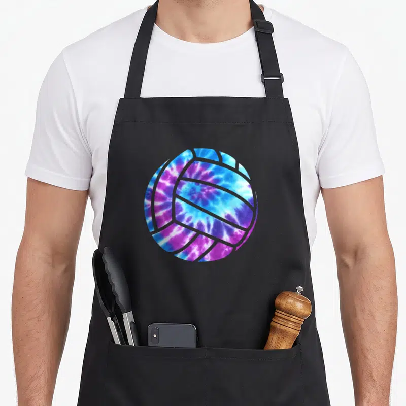 Blue tie-dye apron - Volleyball shape filled with blue purple and white tie-dye pattern — shown on a black cotton canvas apron against a white background
