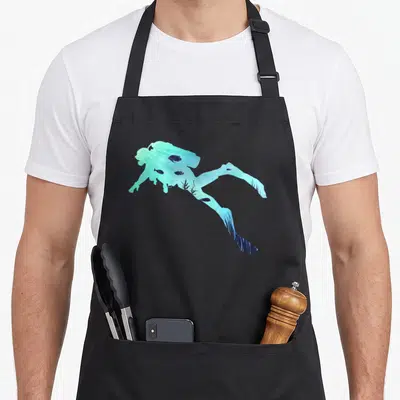Scuba diving life apron - woman silhouette filled with teal blue fish and seaweed ocean scene — shown on a black cotton canvas apron against a white background