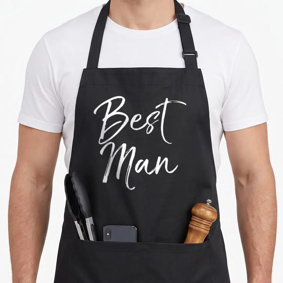 Groomsmen bridal apron - White stacked script text reading Best Man on grey background — shown on a black cotton canvas apron against a white background