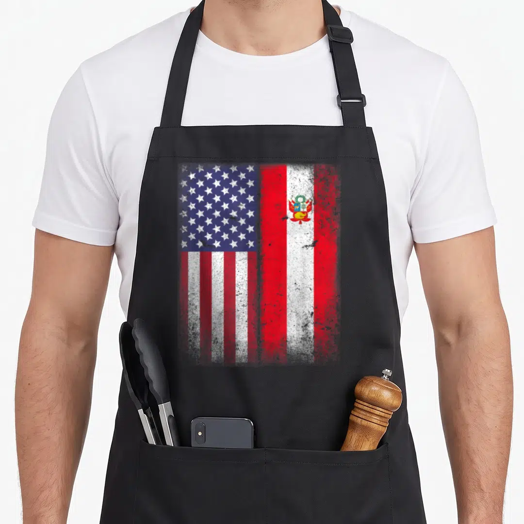 Peru american flag apron - Distressed USA and Peru flags side by side in red white and blue — shown on a black cotton canvas apron against a white background