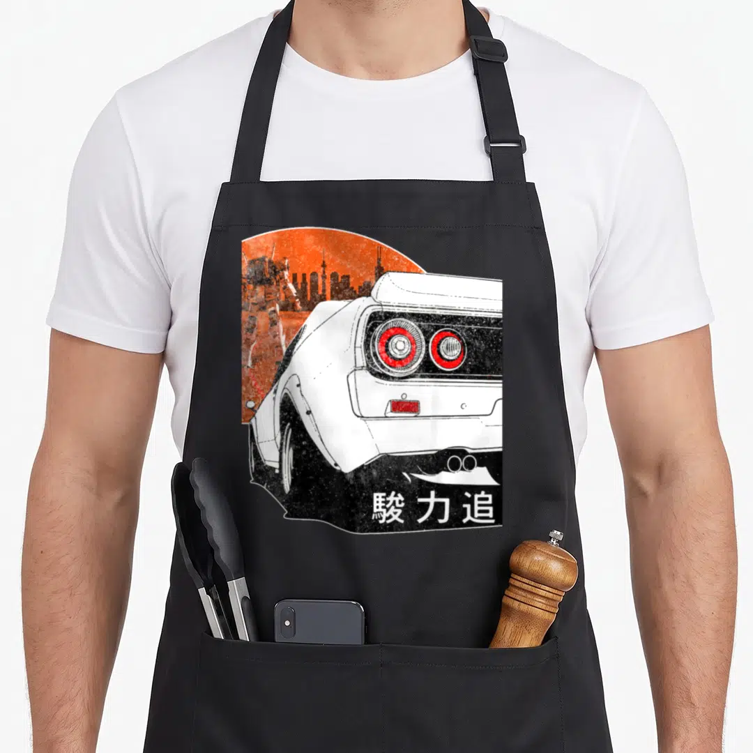 Jdm racing apron - White car rear view, orange sun, robot silhouette, black skyline, kanji text — shown on a black cotton canvas apron against a white background