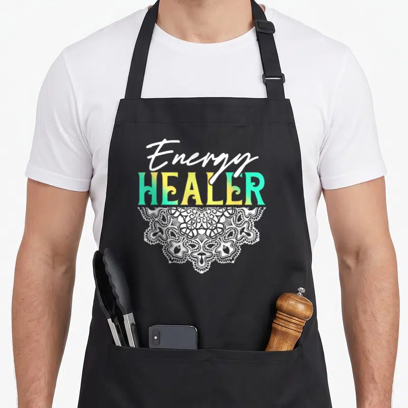 Yoga master apron - Energy HEALER text in yellow and cyan with white script and mandala half-circle below — shown on a black cotton canvas apron against a white background