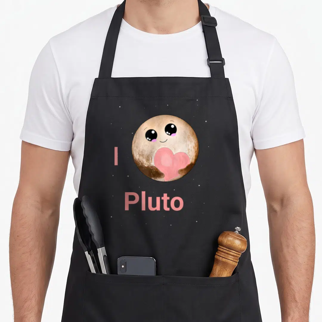 Pluto kawaii apron - Cartoon brown planet holding pink heart with text I Pluto and white stars — shown on a black cotton canvas apron against a white background