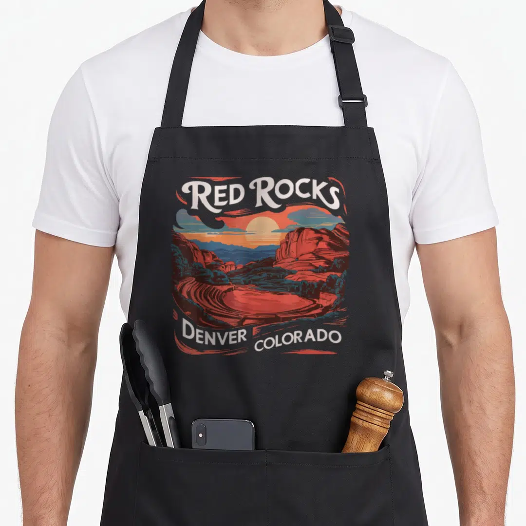 Rock denver colorado apron - Retro Red Rocks Denver Colorado sunset landscape with arched white text and red rock — shown on a black cotton canvas apron against a white background
