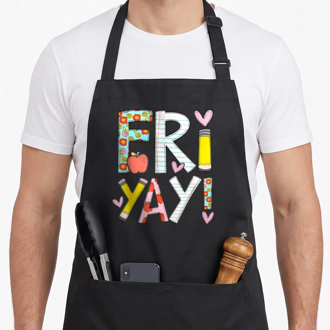 Fri teacher apron - Fri Yay text with pencils apples and hearts in cartoon style — shown on a black cotton canvas apron against a white background