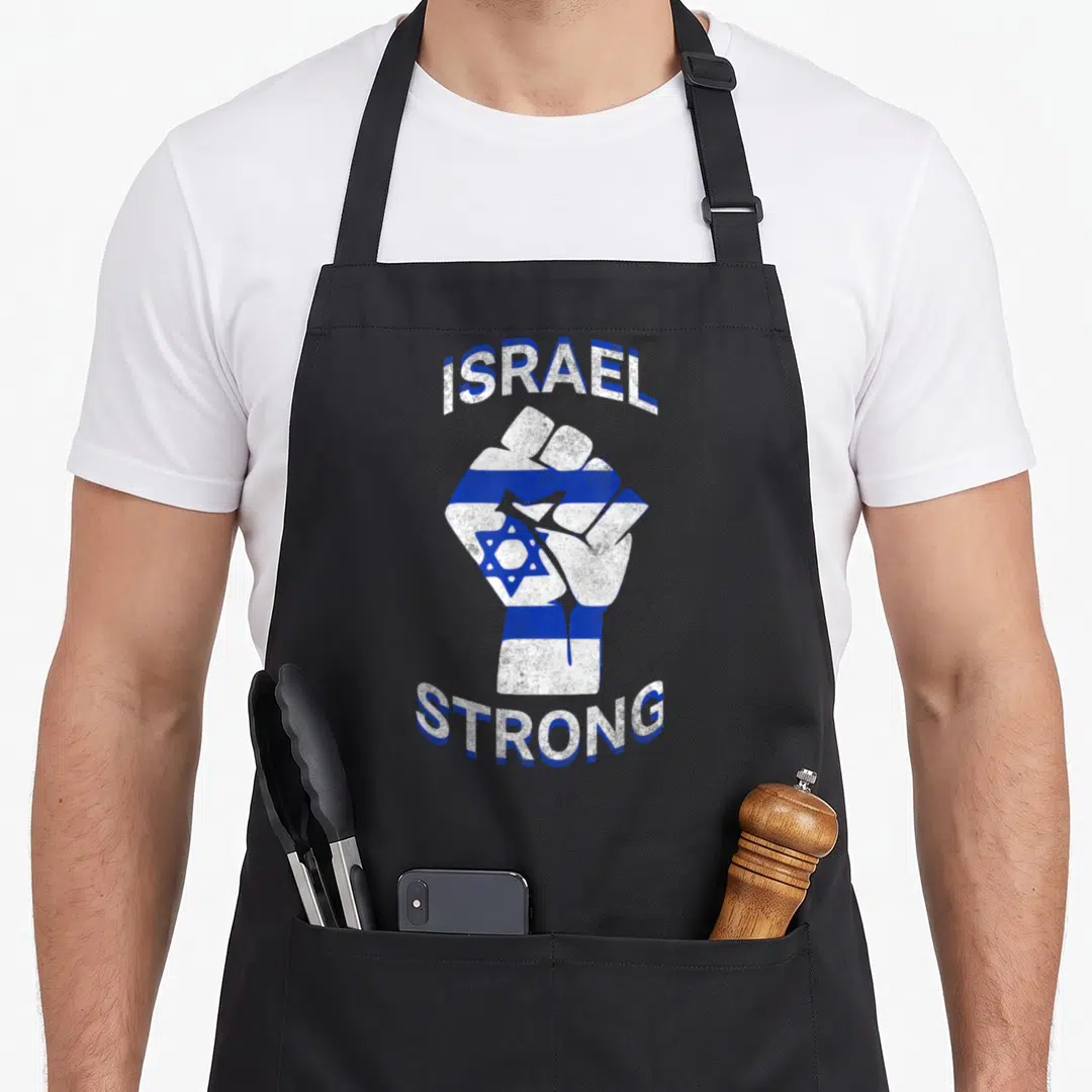 Strong jewish apron - Raised fist with blue white stripes and Star of David surrounded by arched ISRAEL STRONG text — shown on a black cotton canvas apron against a white background