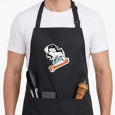 Expanse crew apron - Cartoon woman with orange Rocinante text overlapping figure in white black and blue — shown on a black cotton canvas apron against a white background