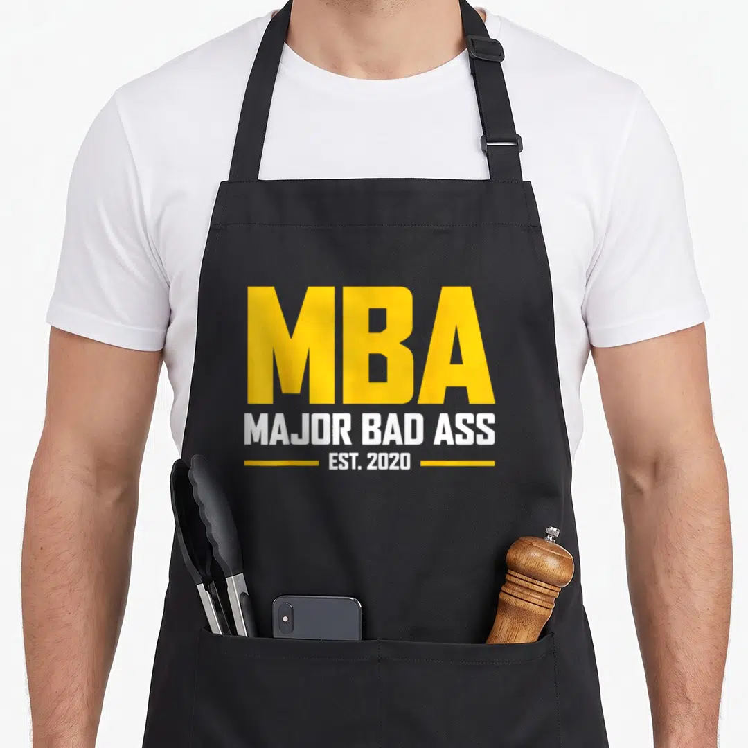 Mba graduation master apron - Yellow and white text reading MBA Major Bad Ass Est 2020 with horizontal lines — shown on a black cotton canvas apron against a white background