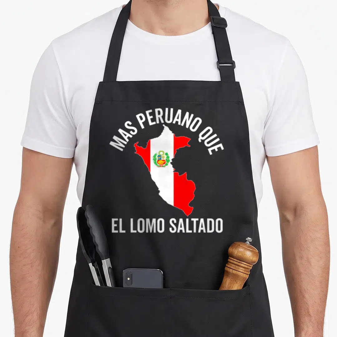 Hombre pride apron - Map of Peru with flag colors and text MAS PERUANO QUE EL LOMO SALTADO — shown on a black cotton canvas apron against a white background