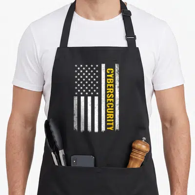 Cybersecurity american flag apron - Vertical distressed white flag with yellow CYBERSECURITY text running down right — shown on a black cotton canvas apron against a white background