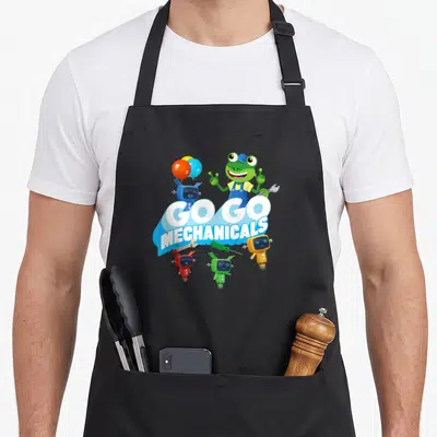 Funny mechanical apron - Cartoon frog and four colored robots around Go Go Mechanicals text on blue banner — shown on a black cotton canvas apron against a white background