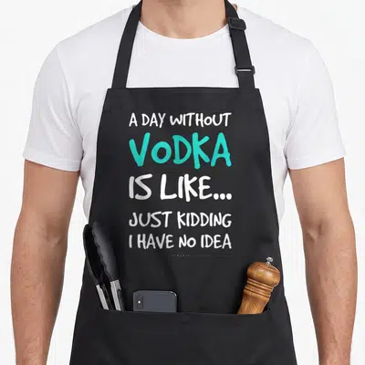 Vodka lumomix apron - White and turquoise typography quote about vodka day without — shown on a black cotton canvas apron against a white background