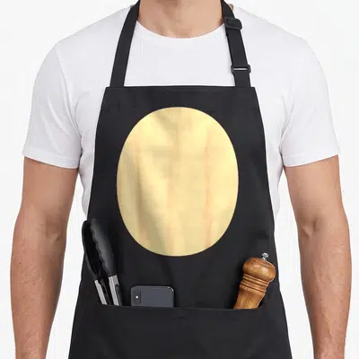 Bear belly halloween apron - Beige oval shape printed on black bib apron — shown on a black cotton canvas apron against a white background