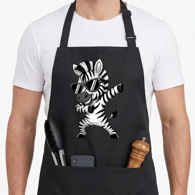 Clothe animal print apron - Cartoon zebra wearing sunglasses and striking a dynamic pose in black and white stripes — shown on a black cotton canvas apron against a white background