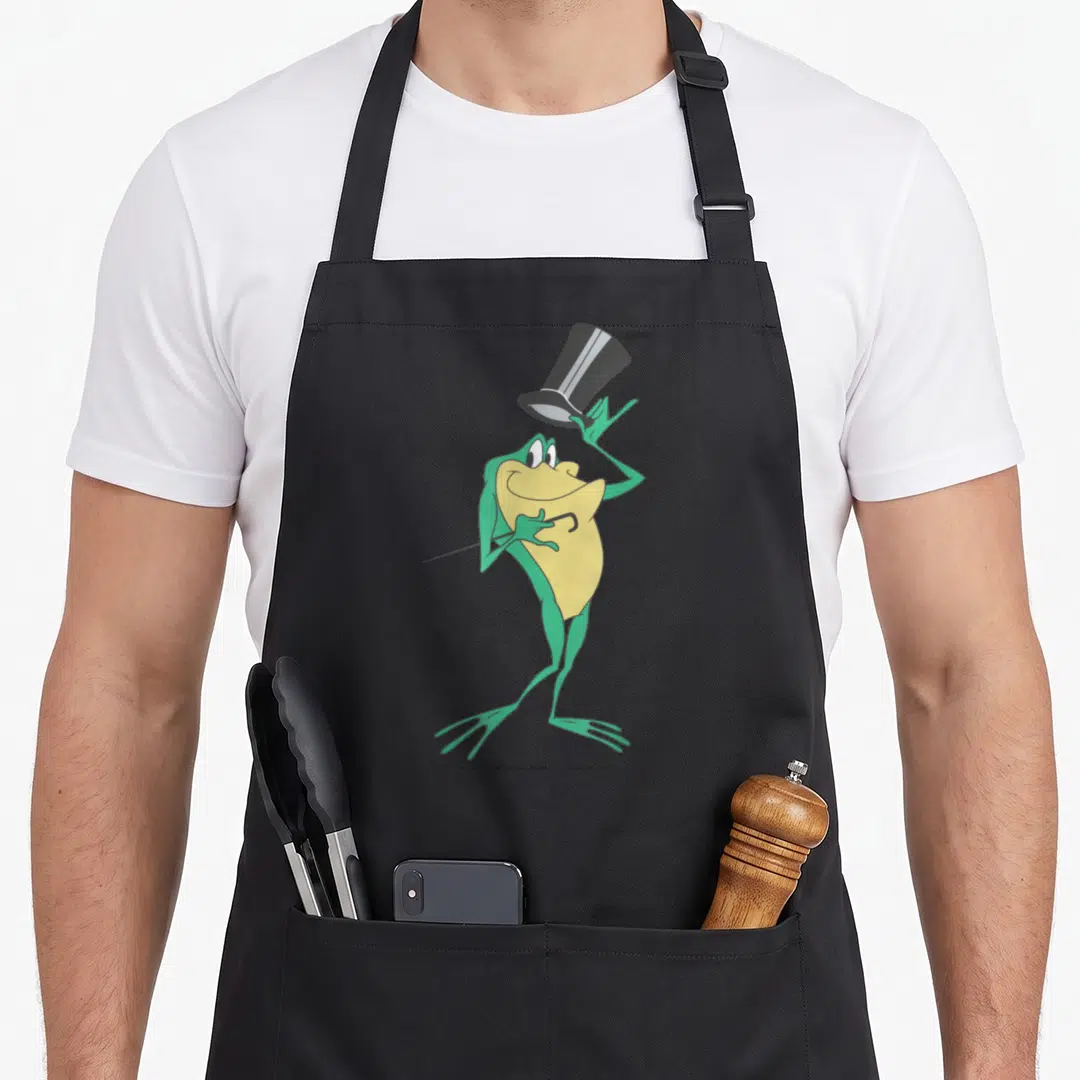 Michigan simple apron - Cartoon frog in green and yellow holding a cane and tipping a top hat on a grey background — shown on a black cotton canvas apron against a white background