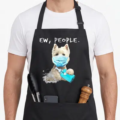 West dog face apron - White dog in blue mask holding sanitizer bottle with ew people text — shown on a black cotton canvas apron against a white background