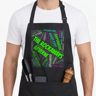 Far new york aprons - Word cloud of The Rockaways neighborhood names in green grey and purple typography — shown on a black cotton canvas apron against a white background