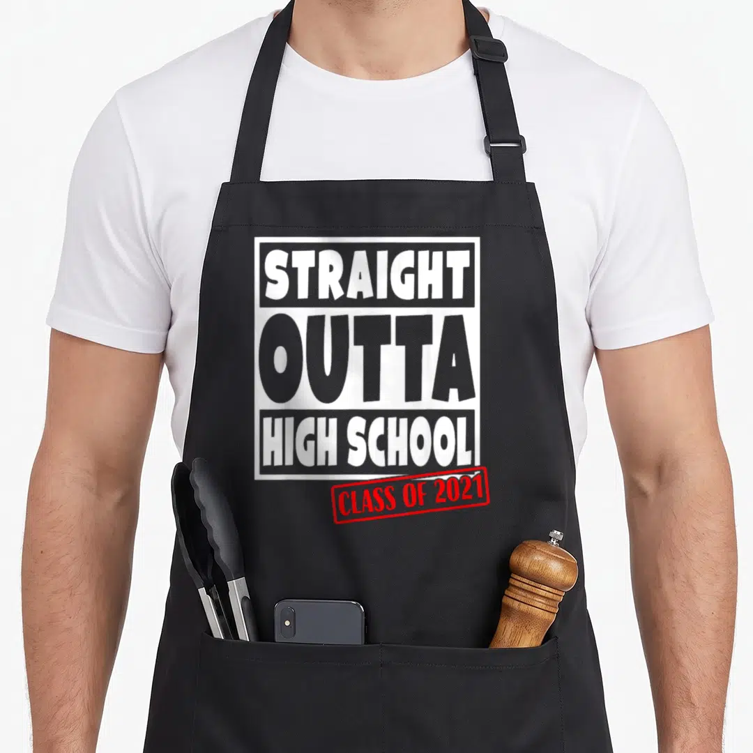 Straight outta school graduation apron - White and red rectangular typography reading STRAIGHT OUTTA HIGH SCHOOL CLASS — shown on a black cotton canvas apron against a white background