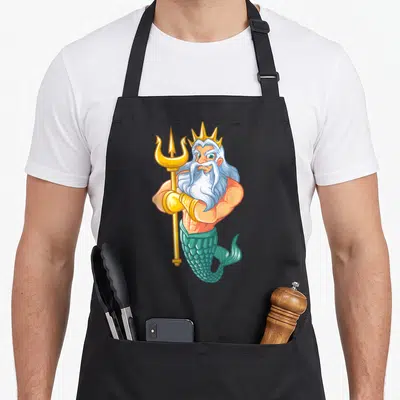 Swimming mermaid apron - Cartoon Poseidon holding a gold trident with teal scaled tail and white beard — shown on a black cotton canvas apron against a white background