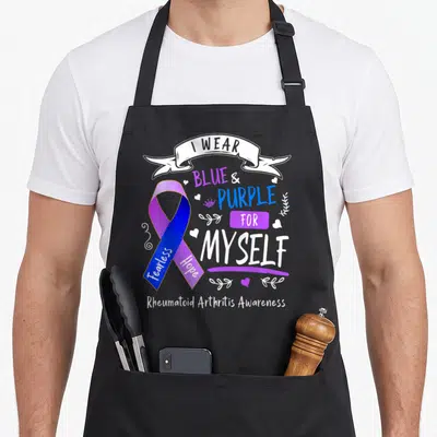 Blue arthritis awareness apron - I WEAR BLUE & PURPLE FOR MYSELF ribbon with Fearless Hope text and hearts — shown on a black cotton canvas apron against a white background