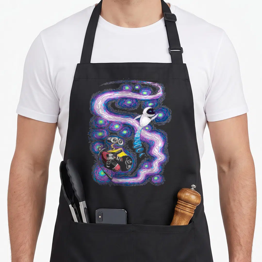Cosmic e.a apron - Watercolor astronaut and robot floating in a swirling purple and blue nebula with glowing stars — shown on a black cotton canvas apron against a white background