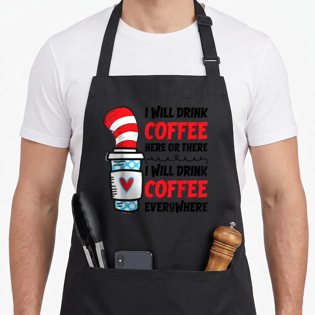 Drink teacher apron - Coffee cup with red white striped hat and text I Will Drink Coffee Here Or There I Will Drink — shown on a black cotton canvas apron against a white background