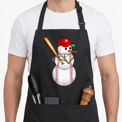 Baseball snowman apron - Cartoon snowman shaped like a baseball with red stitching, red cap, and wooden bat — shown on a black cotton canvas apron against a white background