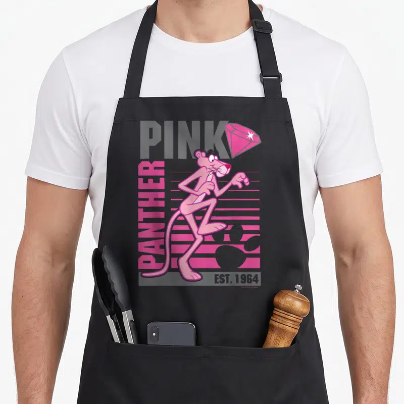 Portrait lined apron - Retro Pink Panther character standing centrally over grey PINK text and vertical pink PANTHER — shown on a black cotton canvas apron against a white background