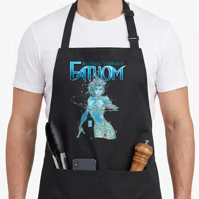 Turner michaels apron - Michael Turner's Fathom logo above blue and white water woman cartoon illustration — shown on a black cotton canvas apron against a white background