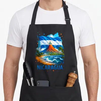 Nicaragua hispanic aprons - Volcano, beach, and waving flag illustration with NICARAGUA text in blue, orange, white — shown on a black cotton canvas apron against a white background